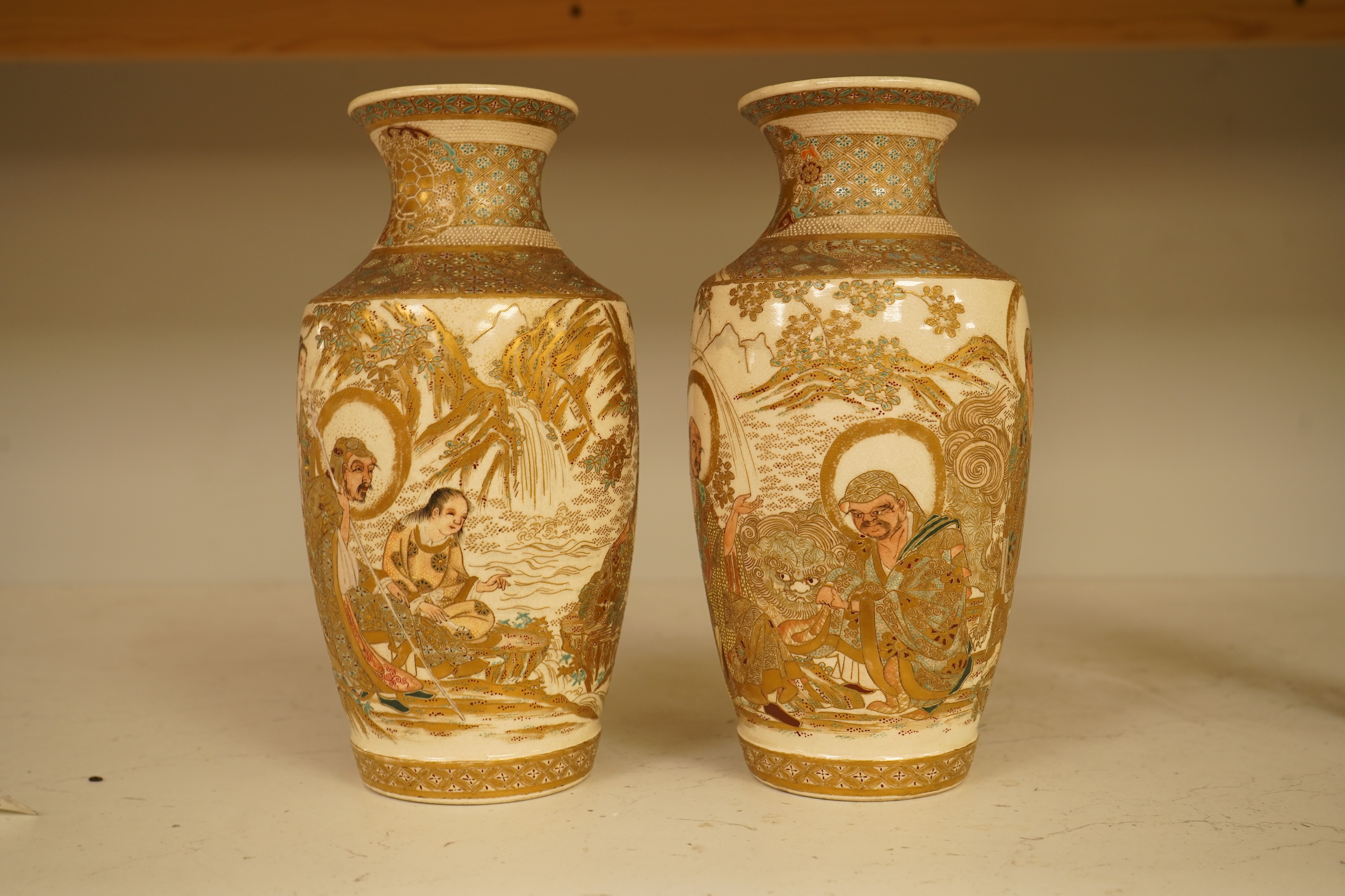 A pair of Japanese Satsuma ‘rakan’ vases, Meiji period, 21cm
